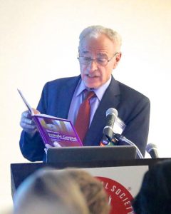 Dr. Goodman reading a passage from his textbook.